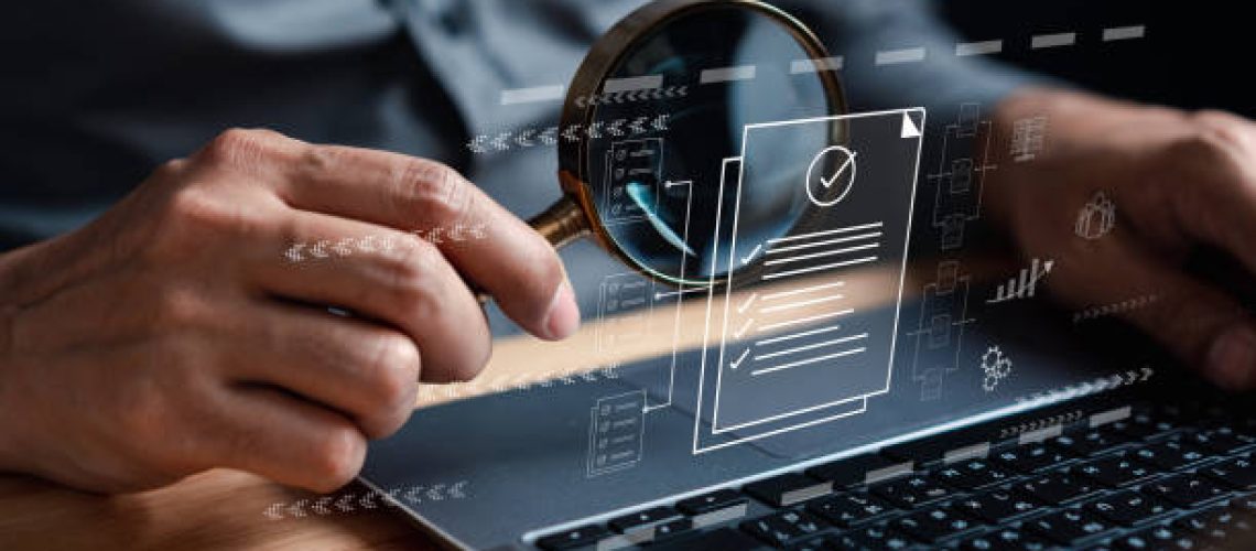 Businessman Inspecting Paperwork Document of Business Data Analysis working Management report with KPI and metrics connected to database. Corporate strategy for finance, operations, sales, marketing.